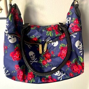 Betsey Johnson bag with roses and cross bones design